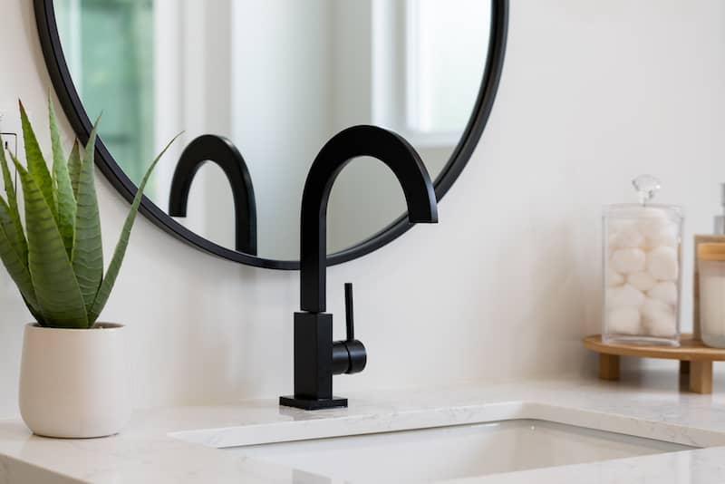 Stock-Modern-Bathroom-Sink-With-Black-Faucet-AdobeStock_577484708-copy